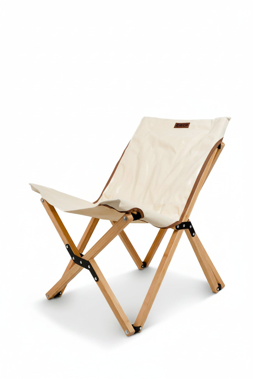 Foldable chair with white seat and wooden frame on a beige background